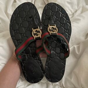 Gucci Black Flip Flops with Gold Emblem